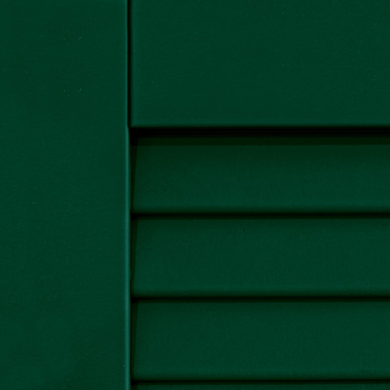 Outside painted green shutters for houses.