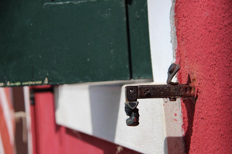 French shutter tieback with two faces.