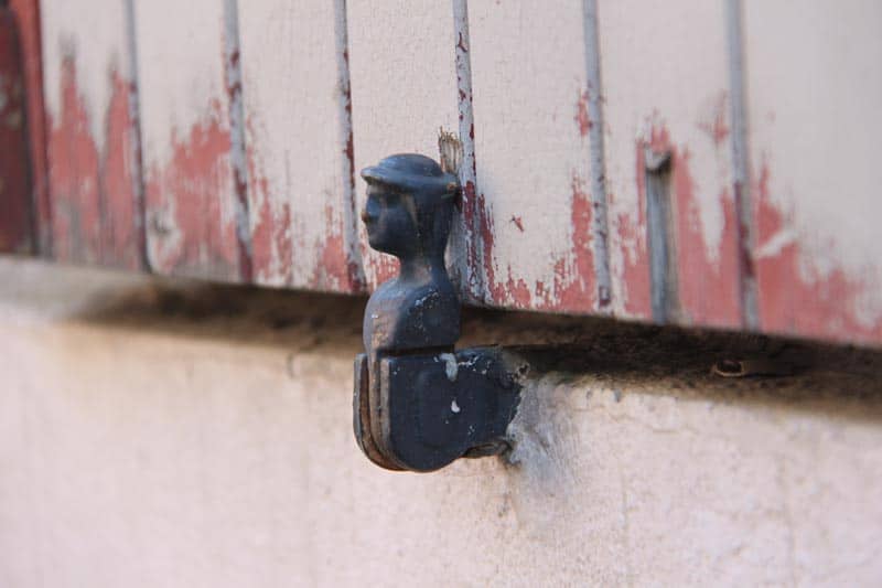 French shutter dogs hold exterior shutters open.