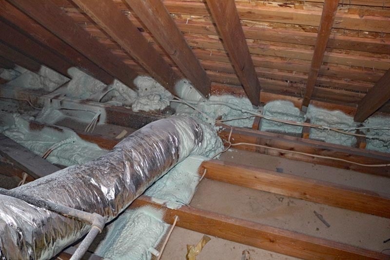 Remove old attic insulation to replace with R55.