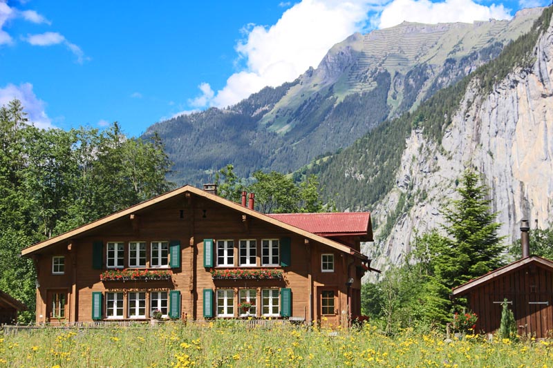 Swiss chalet with green louvered shutters