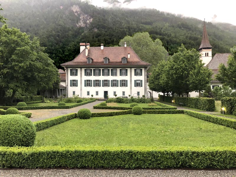 Swiss chateau with outdoor shutters installed on the window.