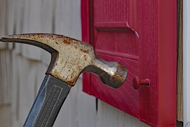 Install vinyl shutters with exterior spikes.