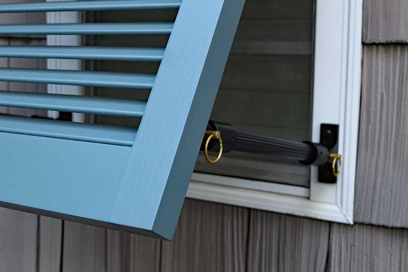 Exterior bahama shutter stay support hardware.