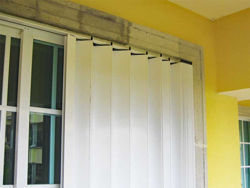Retractable exterior window shade used for tropical storm protection. 