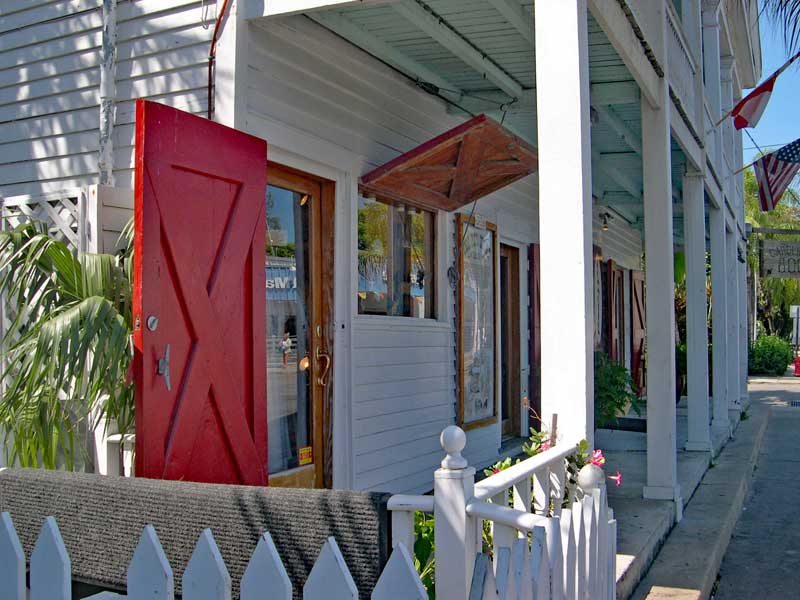 Red board and batten exterior colonial hurricane shutters.