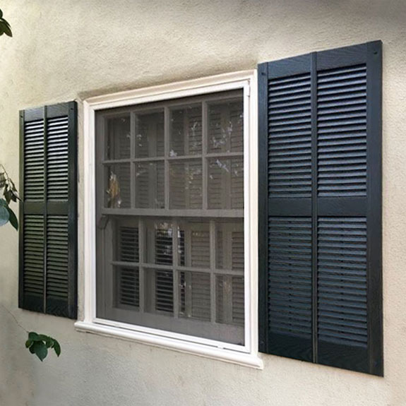 Double wide vinyl louvered shutters installed.