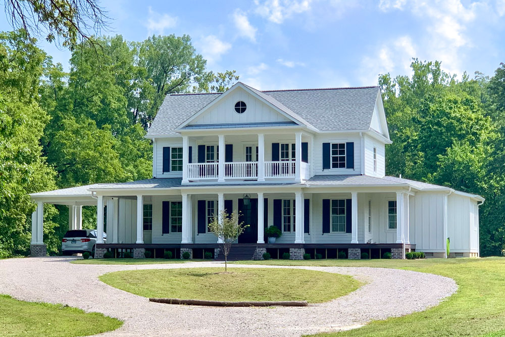 White house with with black composite shutters.