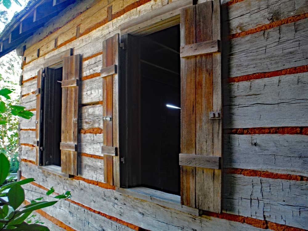Historic board and batten exterior shutters on an old cabin.