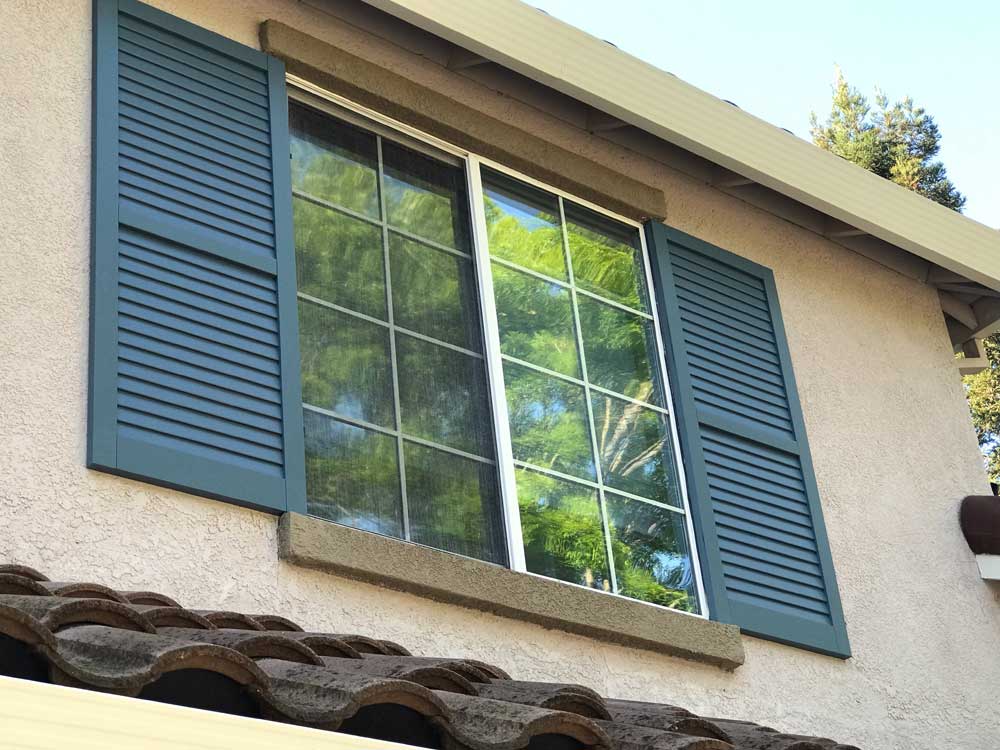 Louvered composite exterior shutters view from below.