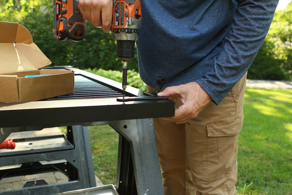 Attaching exterior hinges to install shutters to brick.