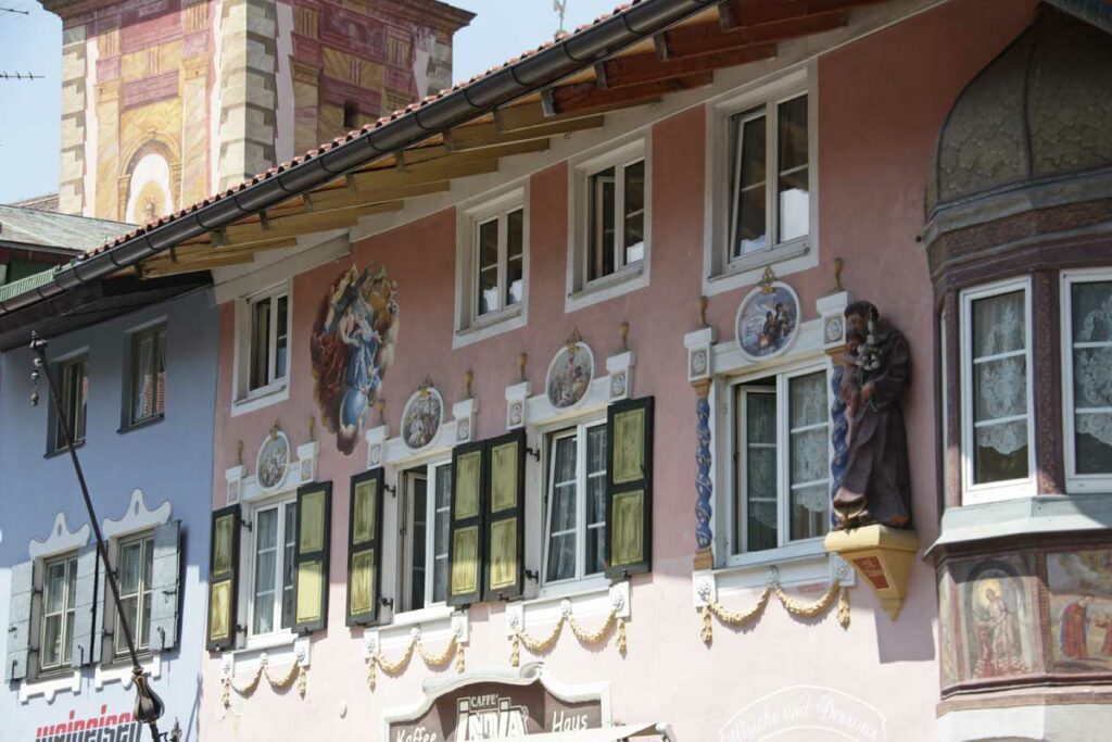 Exterior gold shutters on building in Europe.