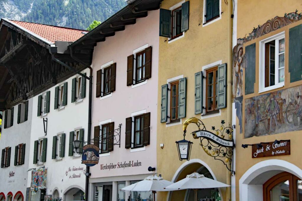 German street adorned with painted exterior window shutters.