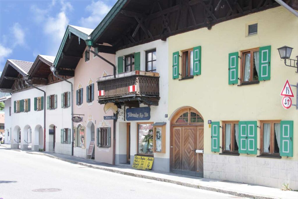 Green with white window shutters in Bavaria, Germany.