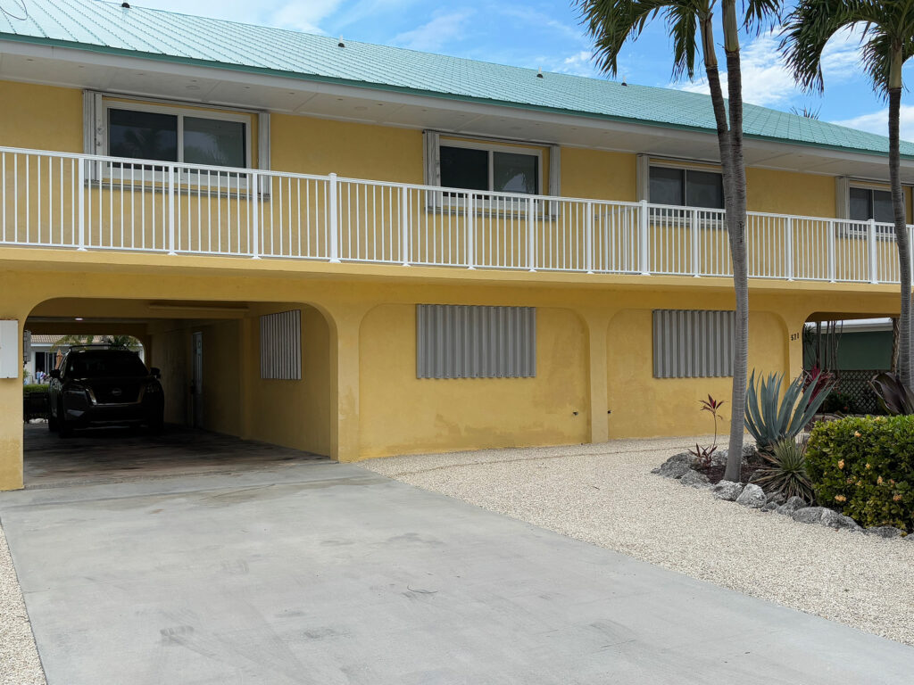Corrugated metal storm panels used to protect windows during a hurricane.