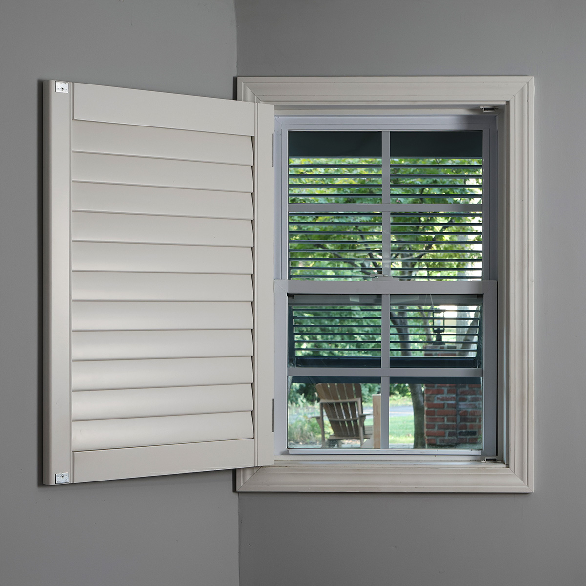 Inside view through an open wood outdoor Bahama shutter.