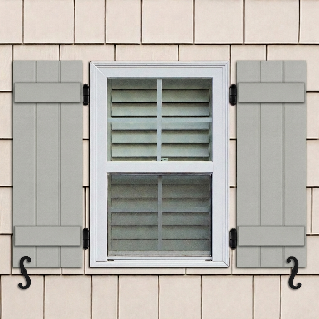 Gray PVC board and batten exterior shutters with 2 battens installed on a window with functional hardware.